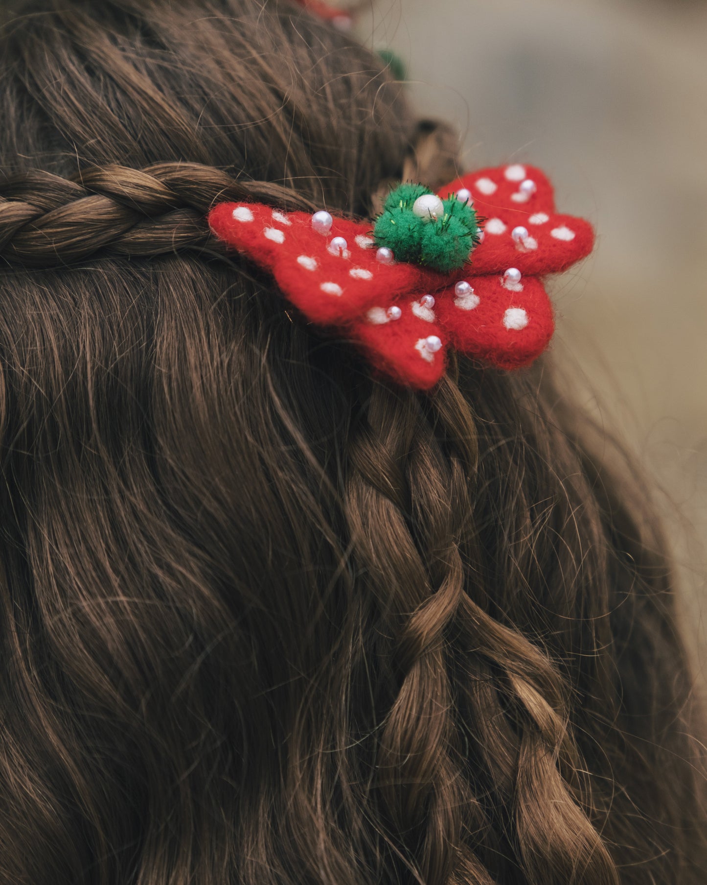 Little girl wearing the Snowy Bow of Wishes for a cozy winter holiday gathering