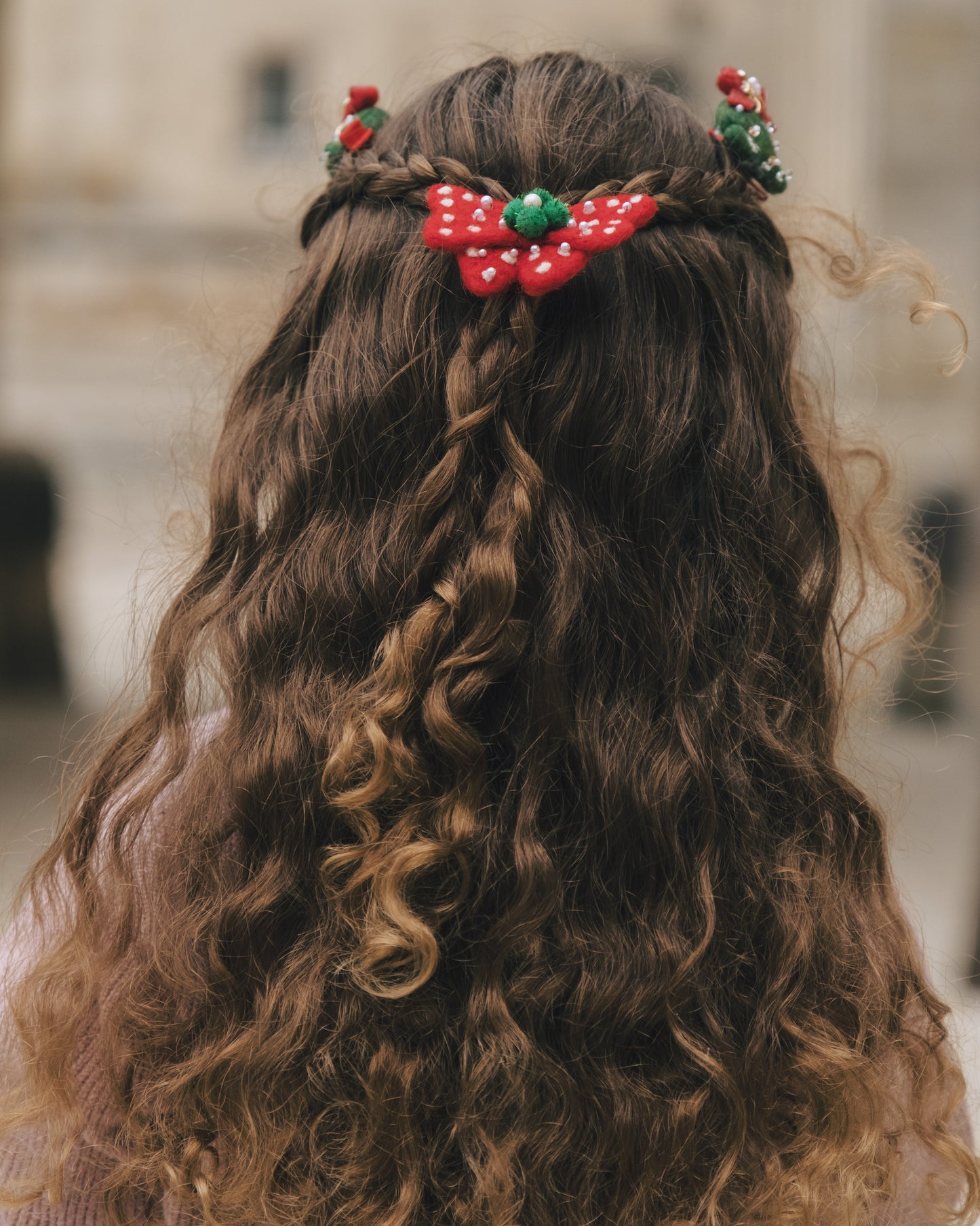 Little girl wearing the Snowy Bow of Wishes for a cozy winter holiday gathering
